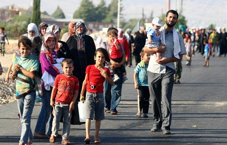 Refugees fleeing Syria`s Tel Abyad begin entering Turkey